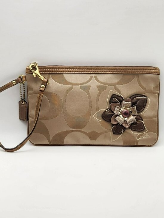Coach Handbags - Coach wristlet with flower and hangtag brown purple GUC